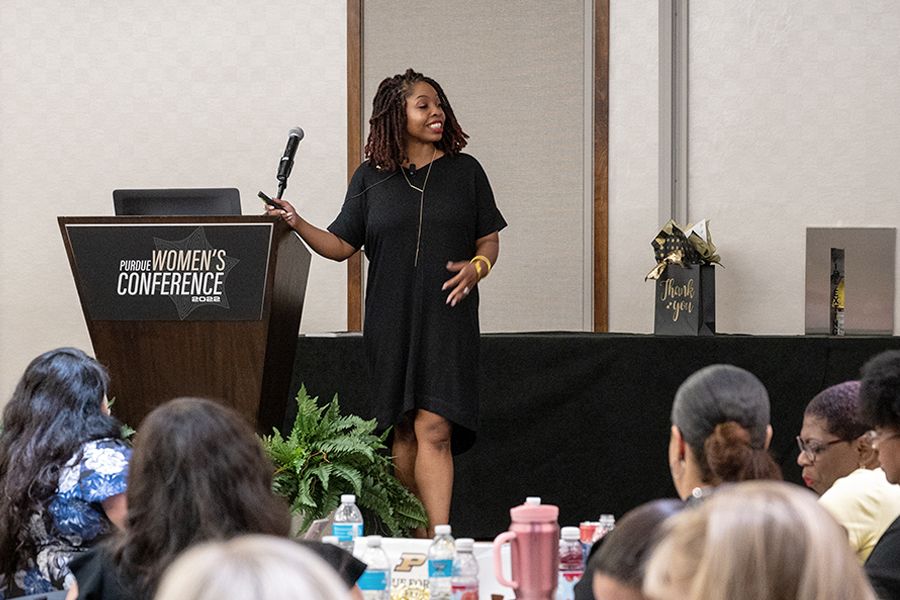The image shows attendees at the Purdue Women's Conference