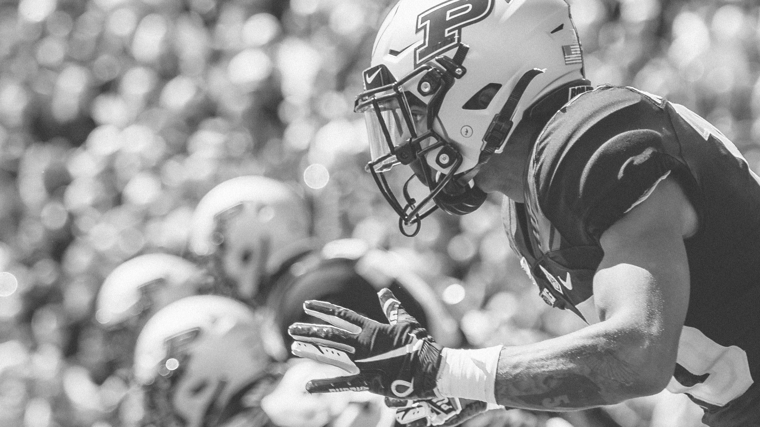 The image shows a Purdue football player