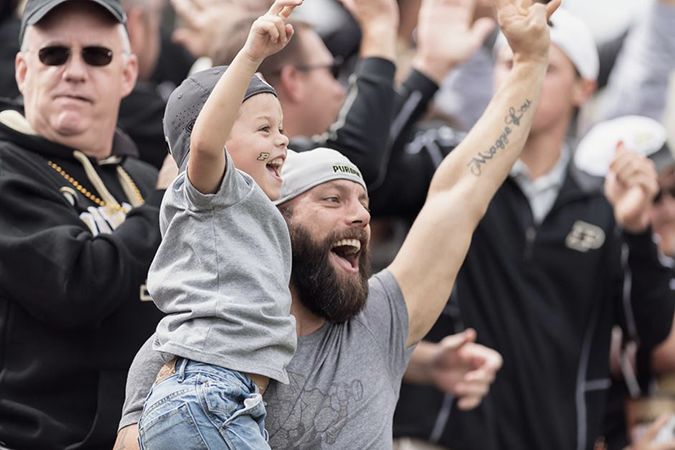 The image shows cheering Purdue fans