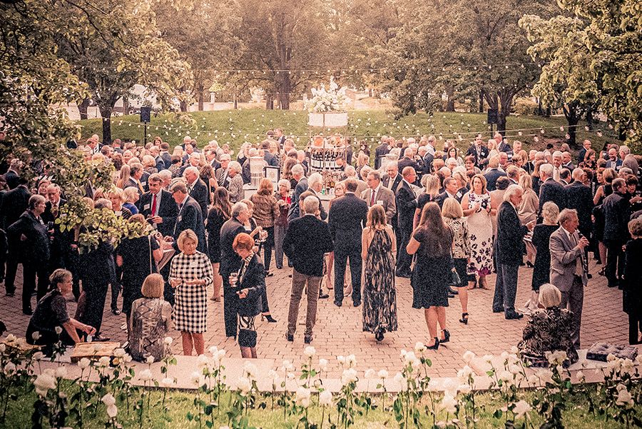 The image shows people gathered at the President's Council Annual Dinner