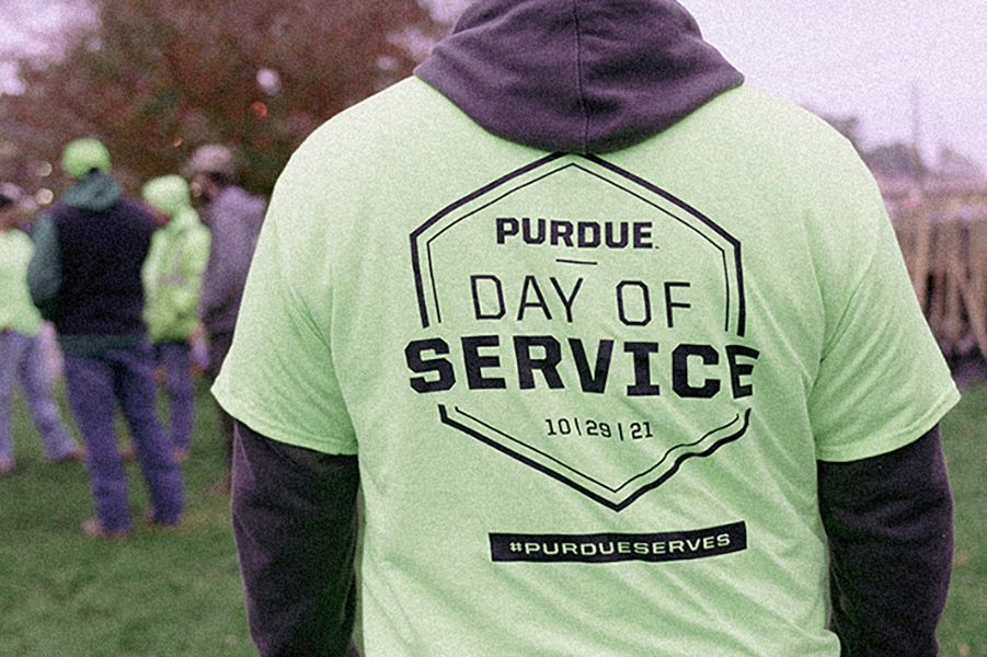 The image shows a Purdue Day of Service T-shirt