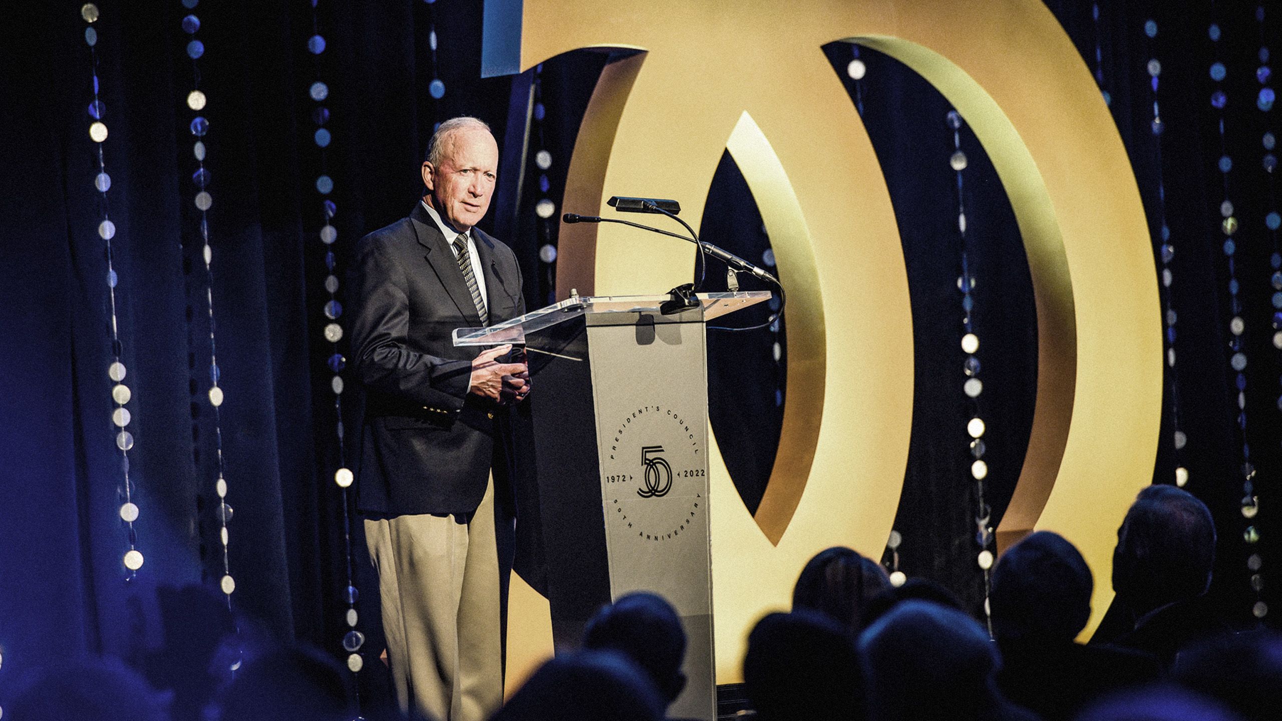The image shows Purdue President Mitch Daniels