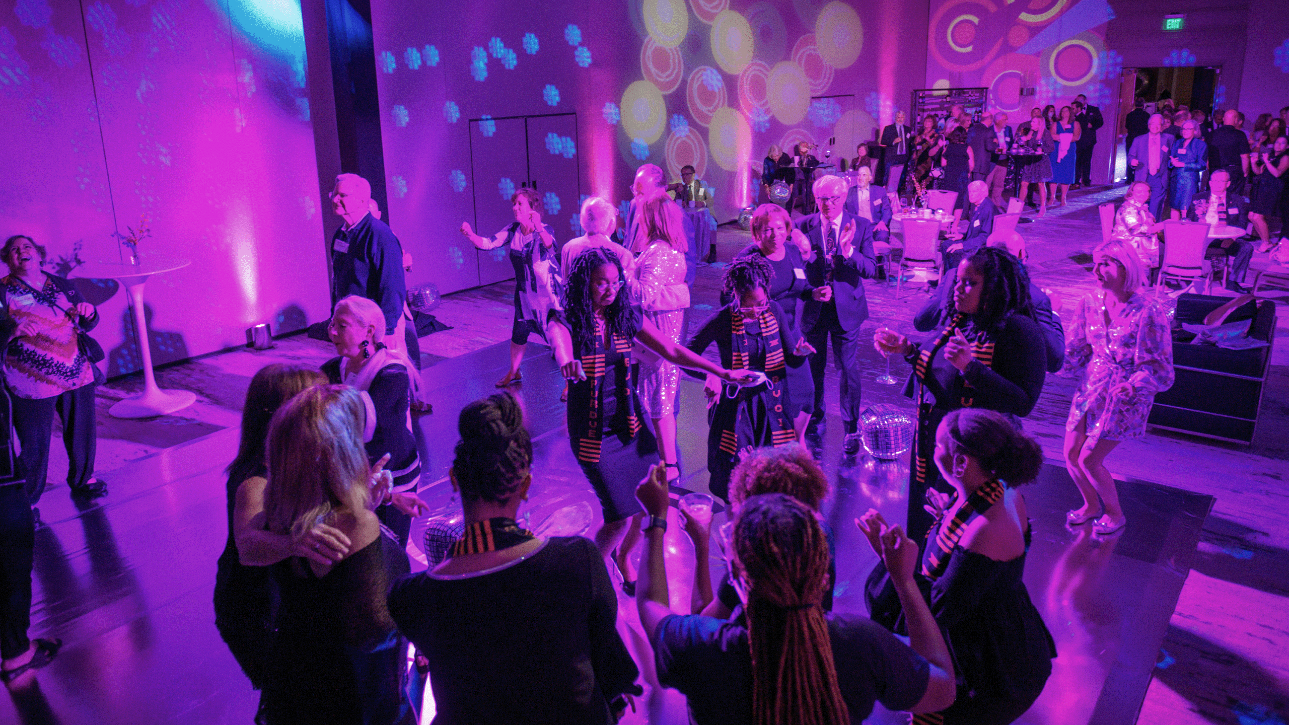 The image shows people dancing