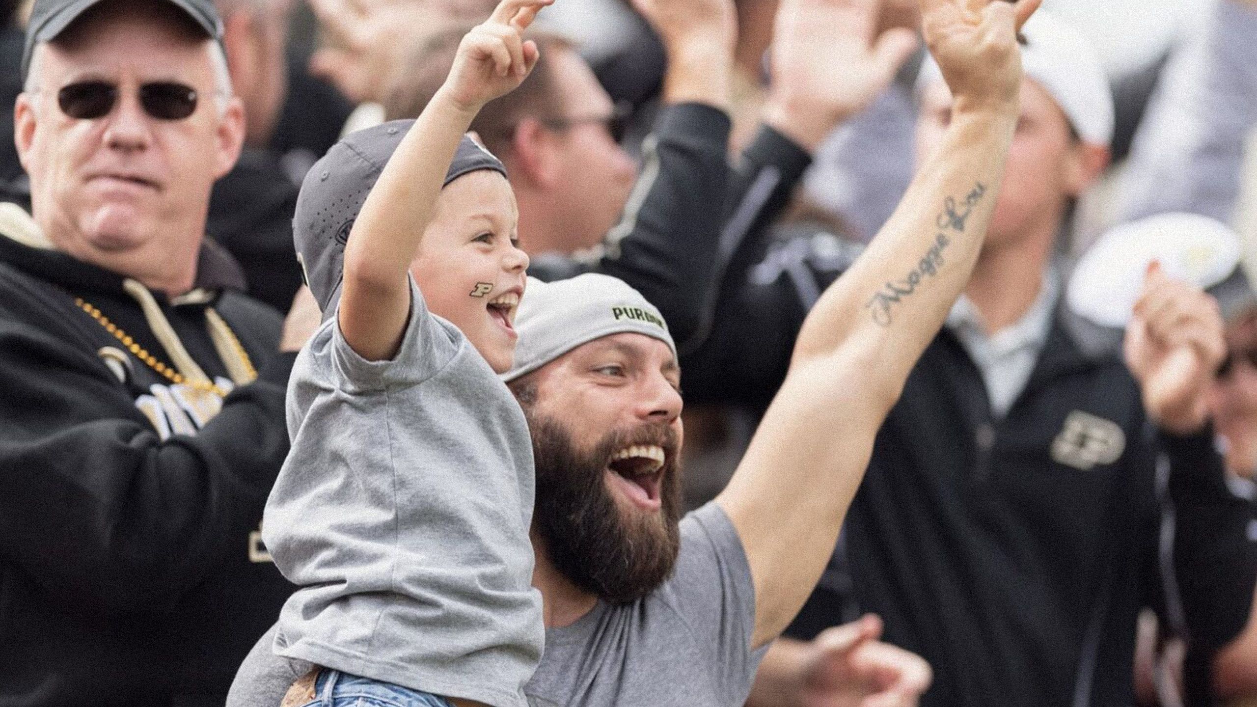 The image shows cheering Purdue fans