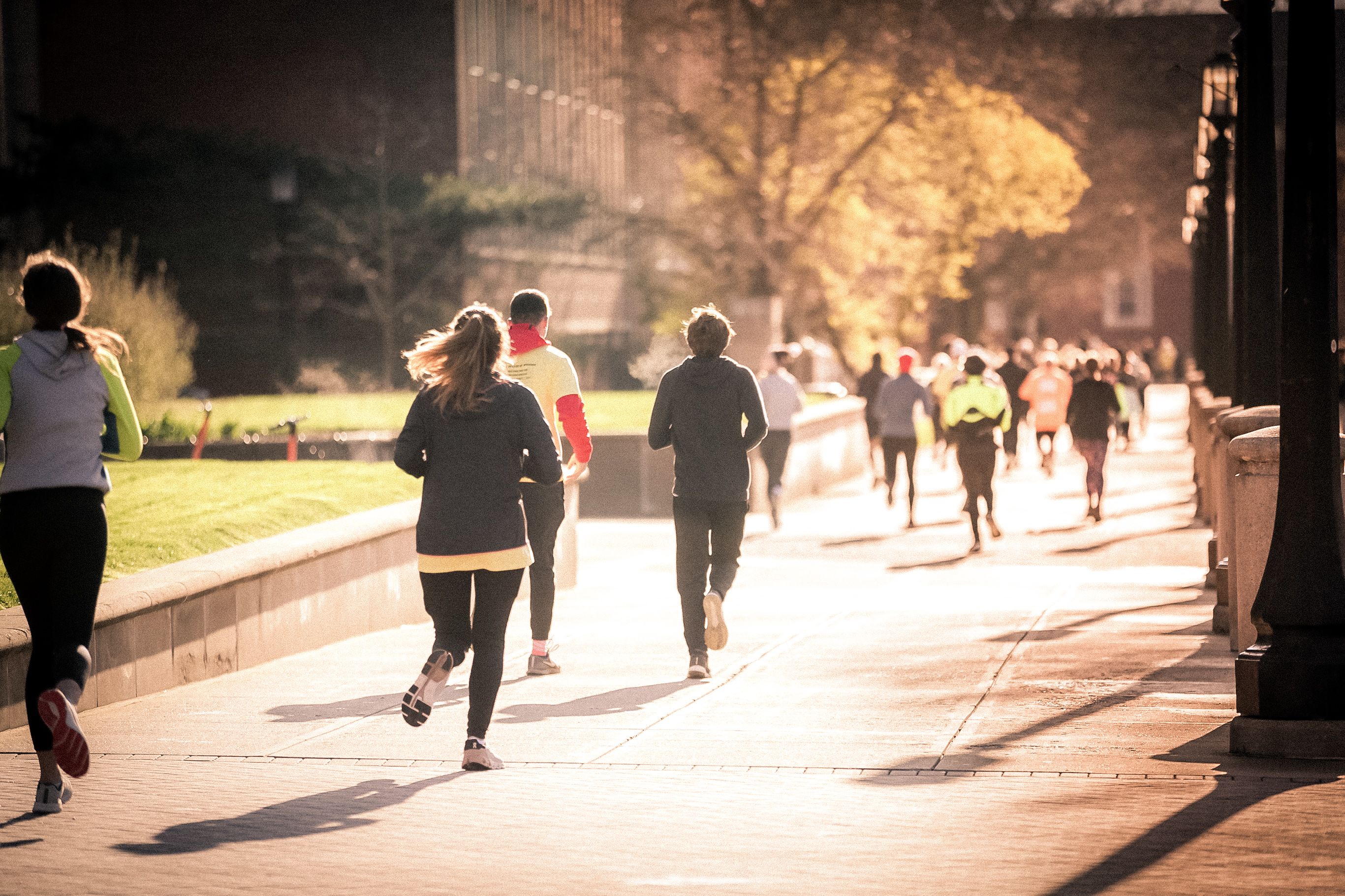 The image shows 5K participants running
