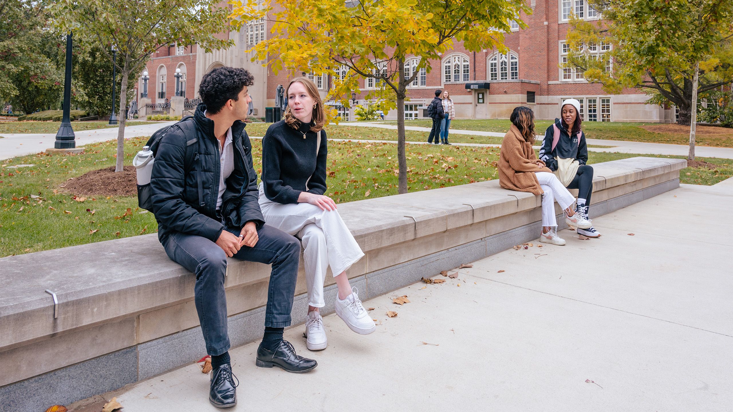 Students sit outside the Purdue Memorial Union