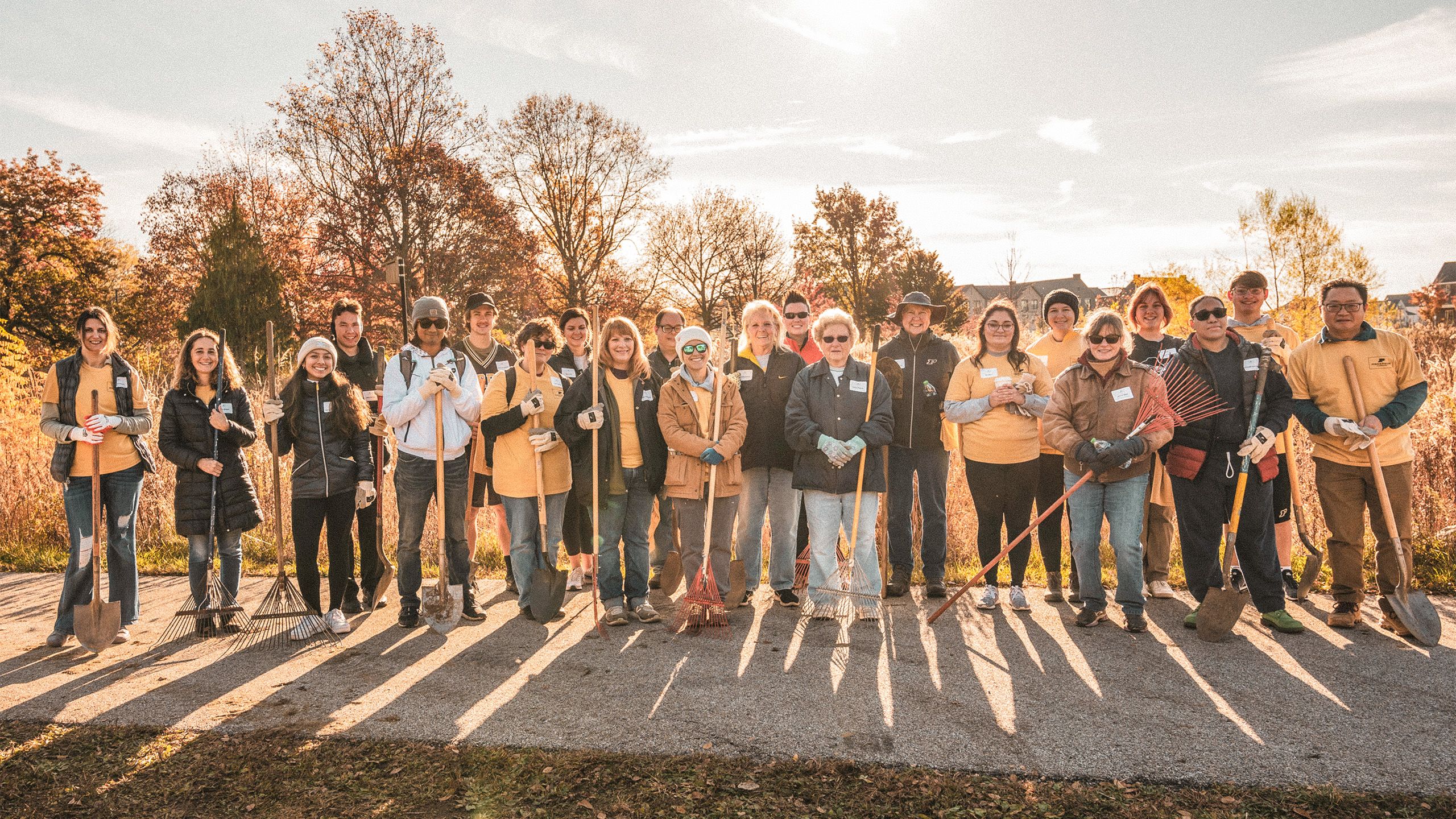 Volunteers holding shovels