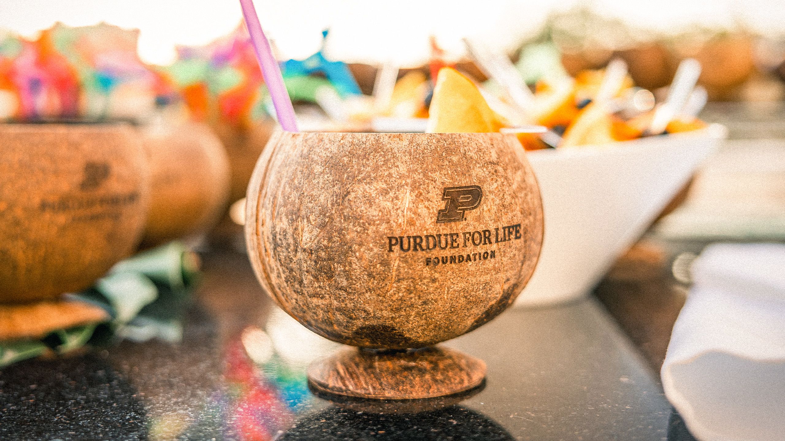 Tropical drink with the Purdue for Life Foundation logo on the cup