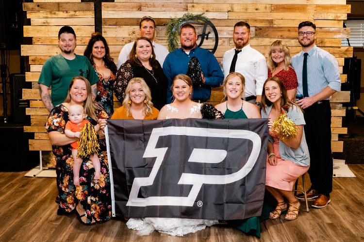 The image shows guests at a wedding