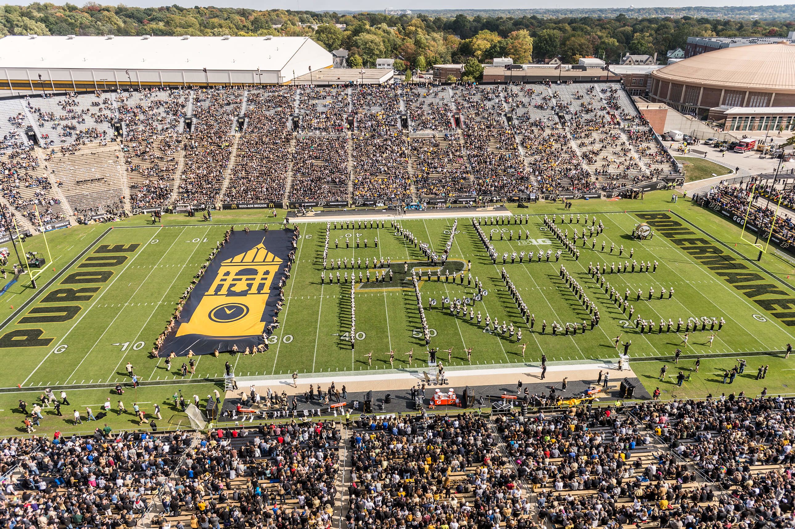 The "All-American" Marching Band forms the words "Ever True" on the field at Ross-Ade Stadium