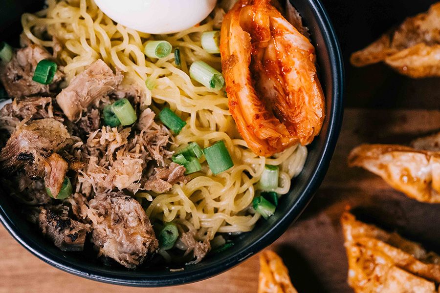 Asian noodle bowl and fried dumplings