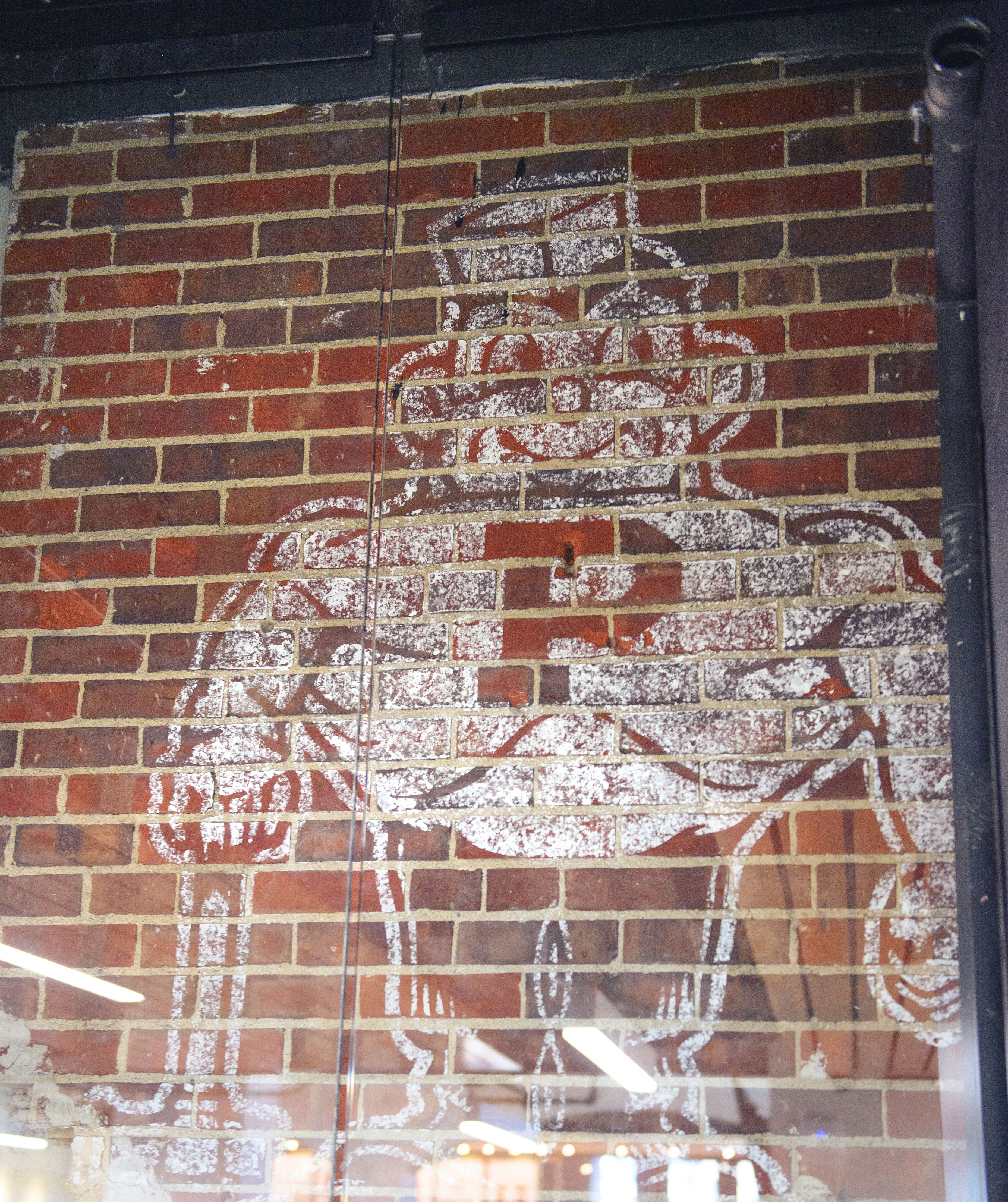 Retro Purdue Pete logo painted on a brick wall