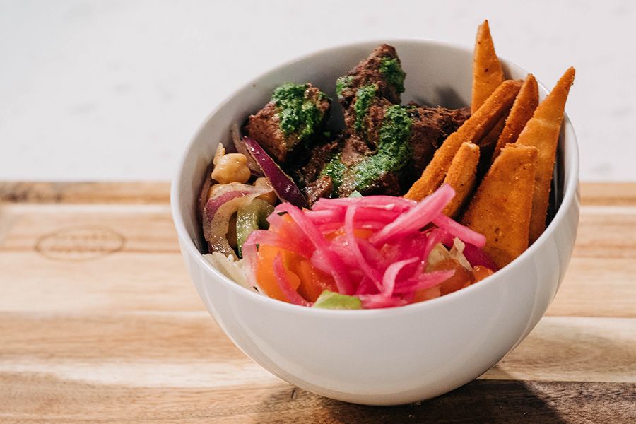 A bowl containing contemporary Indian cuisine