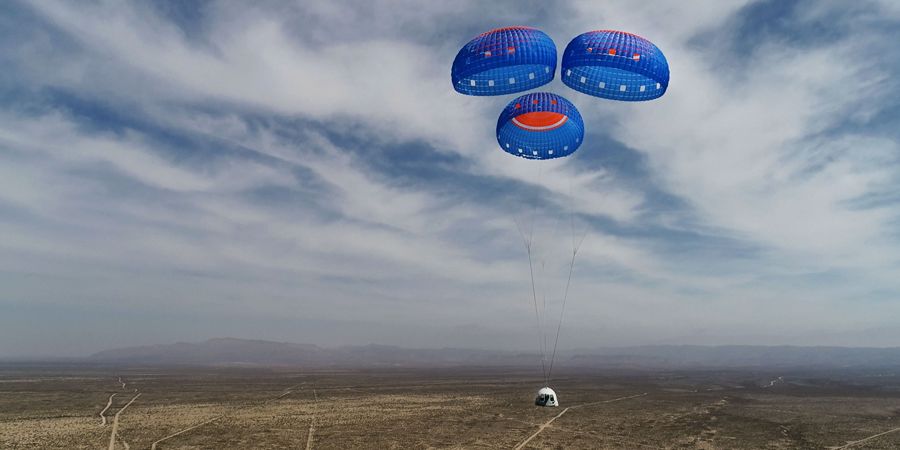 The image shows a Blue Origin capsule descent