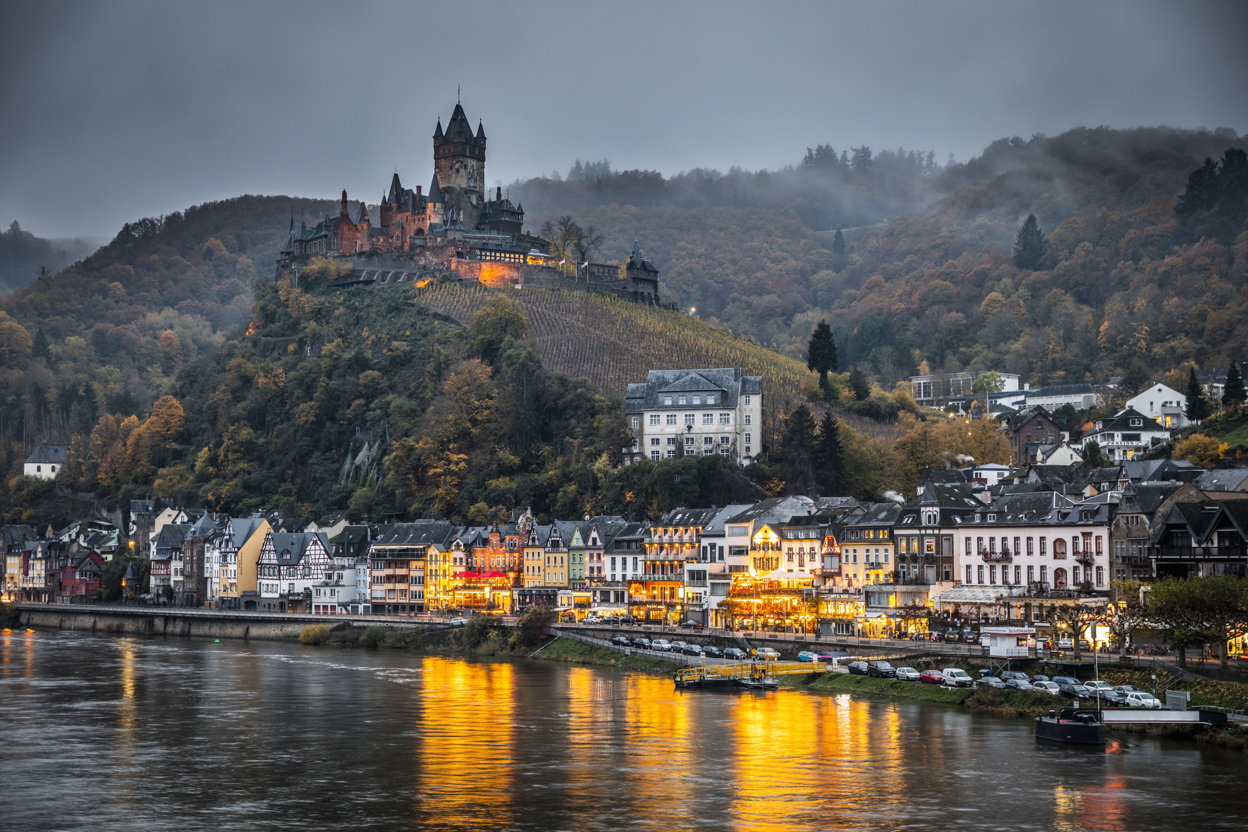 Cochem with its typical half-timbered houses the famous Reichsburg Imperial castle . Mittelmosel, Moselle river, Rhineland-Palatinate at autumn time, Germany, Europe
